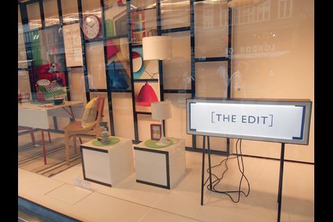 Part of the John Lewis front-of-store display features a window with a Mondrian-like frame where instead of slabs of colour there are products and pictures of products.